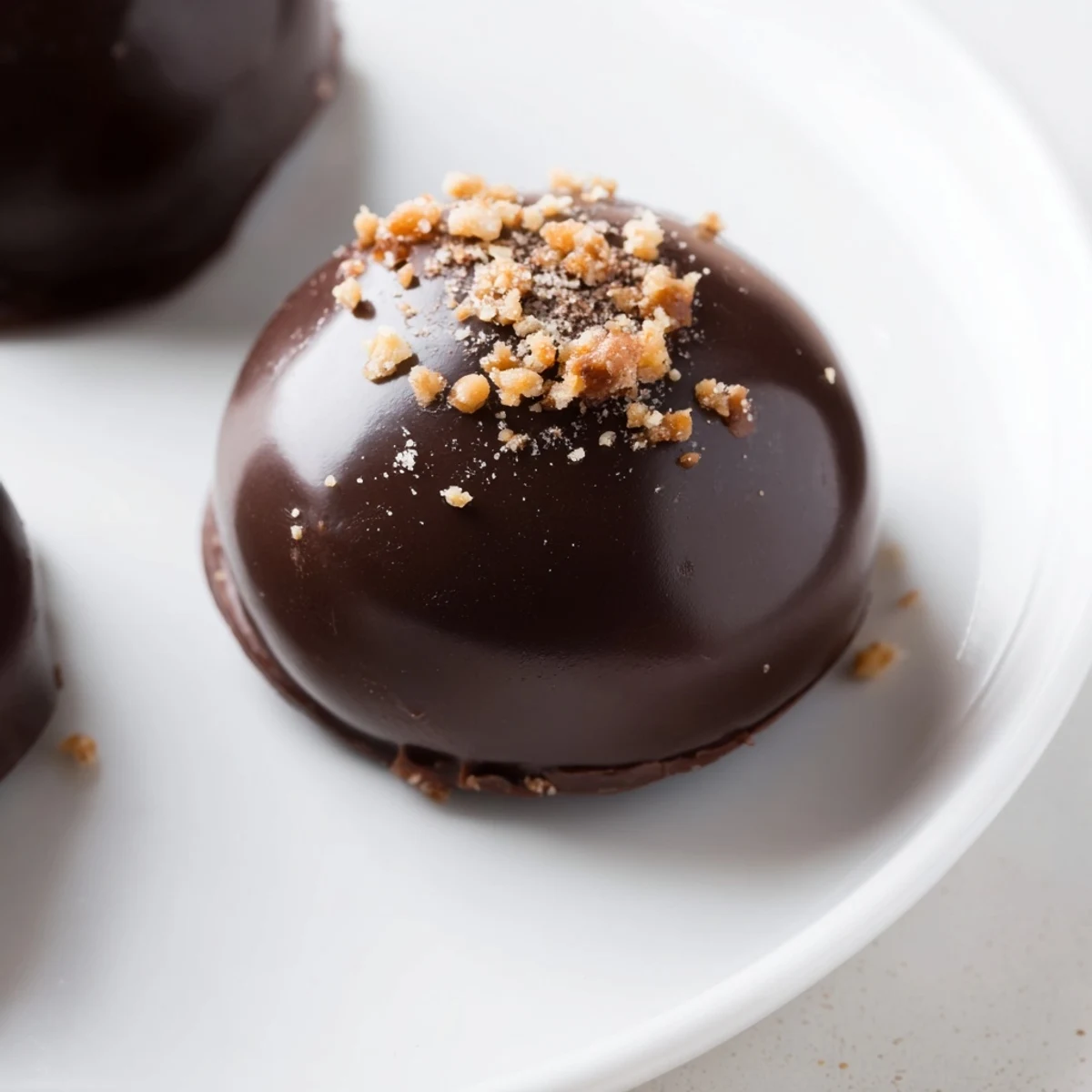 The glossy finish on these Irish Cream Truffles with Dark Chocolate highlights the rich ganache center.