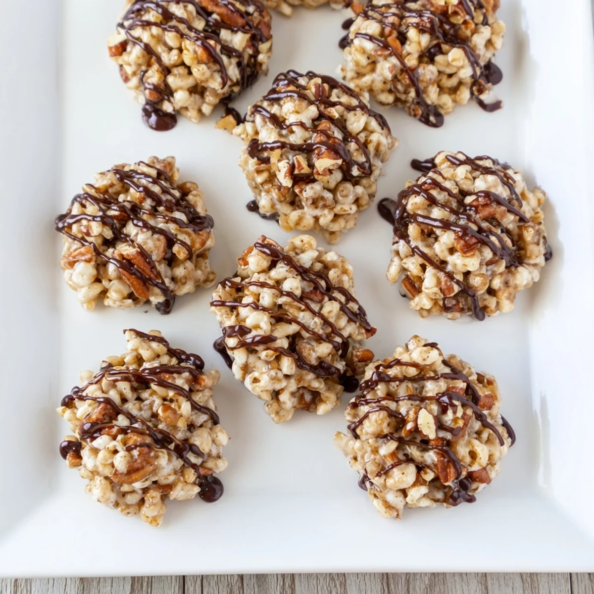 Frosted with melted chocolate, these No Bake Coffee Crunch Rice Krispie Cookies feature crispy, chewy texture and rich espresso aroma on a marble countertop.