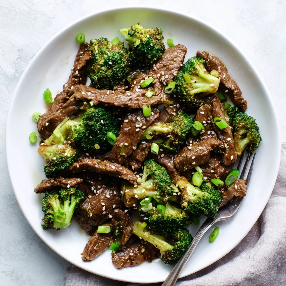 Tender beef and crisp broccoli coated in savory brown sauce over steamed rice in the Better Than Takeout Beef With Broccoli.