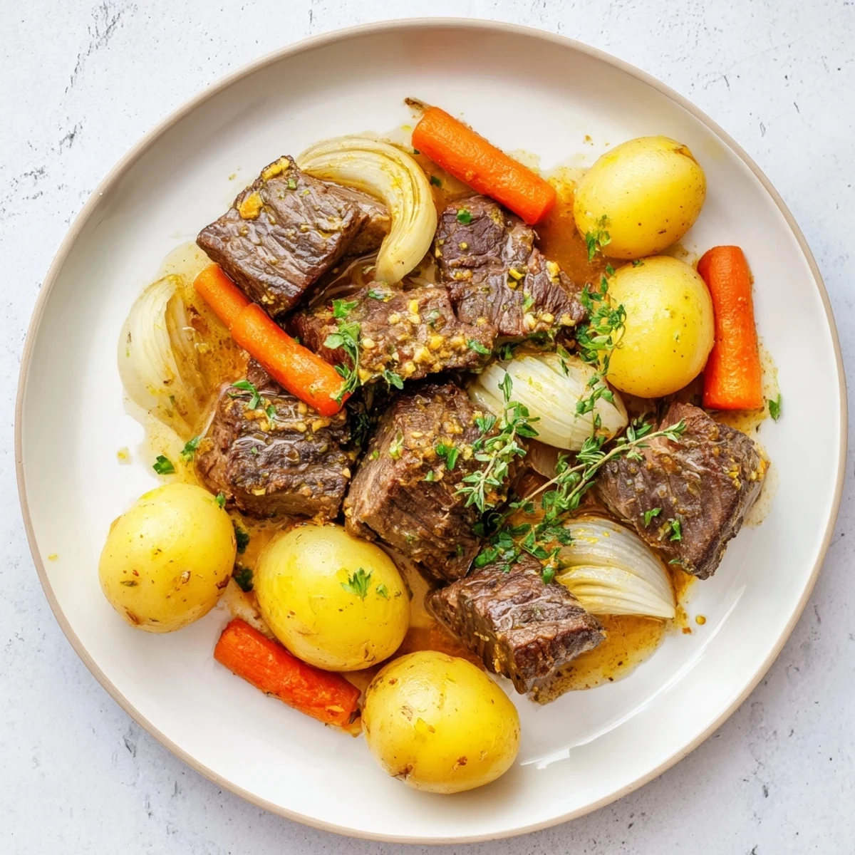 Fork-tender Slow Cooker Garlic Butter Beef with Potatoes, simmered in a rich, herby butter sauce for a comforting family meal.