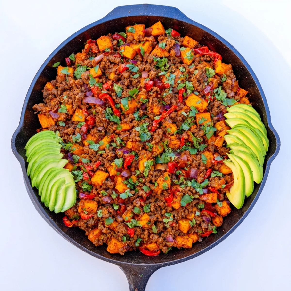 Golden brown ground beef skillet with tender sweet potatoes and colorful Southwest vegetables