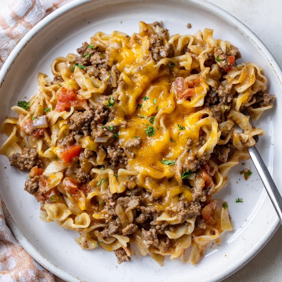 A hearty Beef Noodle Casserole spooned into bowls, steam rising