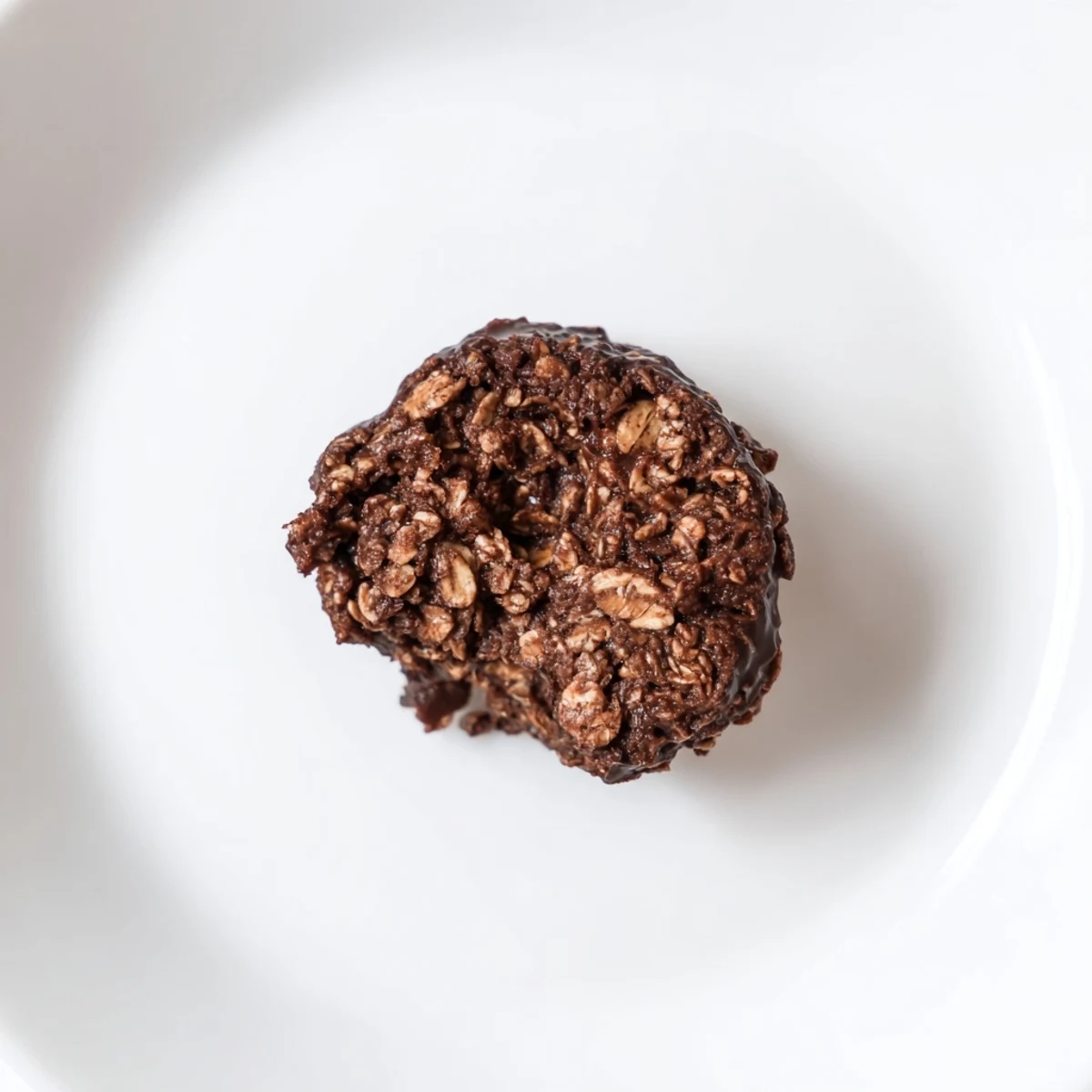 A jar of Brownie Protein Bites ready for grab-and-go protein snacks.