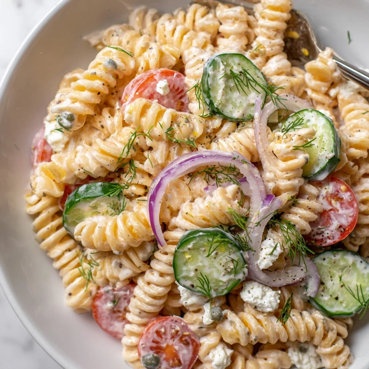 Cucumber Pasta Salad with creamy lemon dill dressing, crisp cucumbers and tomatoes