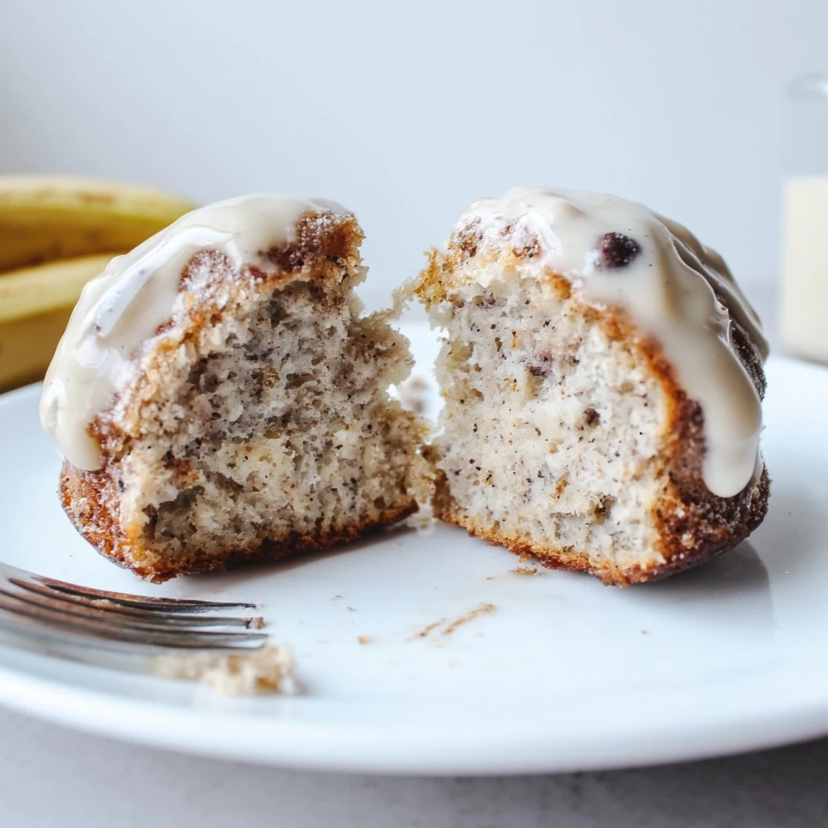 Freshly baked Banana Donuts cooling on a rack, warm aroma of cinnamon