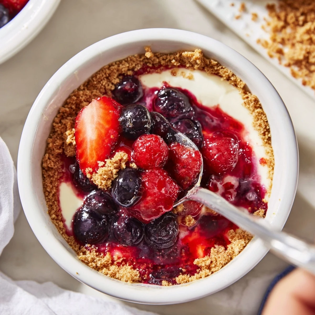 Individual Berry No Bake Cheesecakes chilled, creamy filling topped with juicy berries