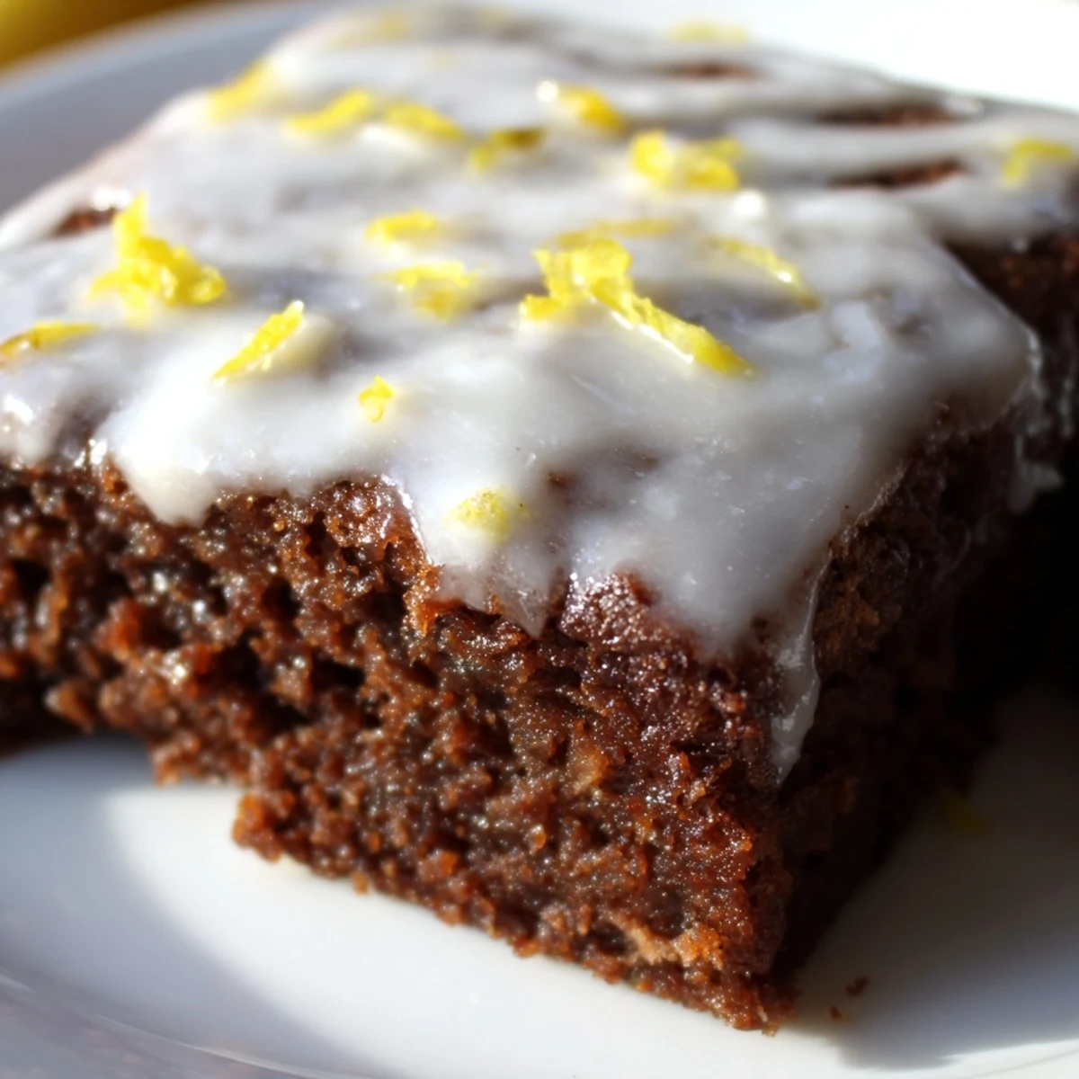 Rich buttery lemon brownies featuring a crackled topped glazed finish and bright citrus aroma