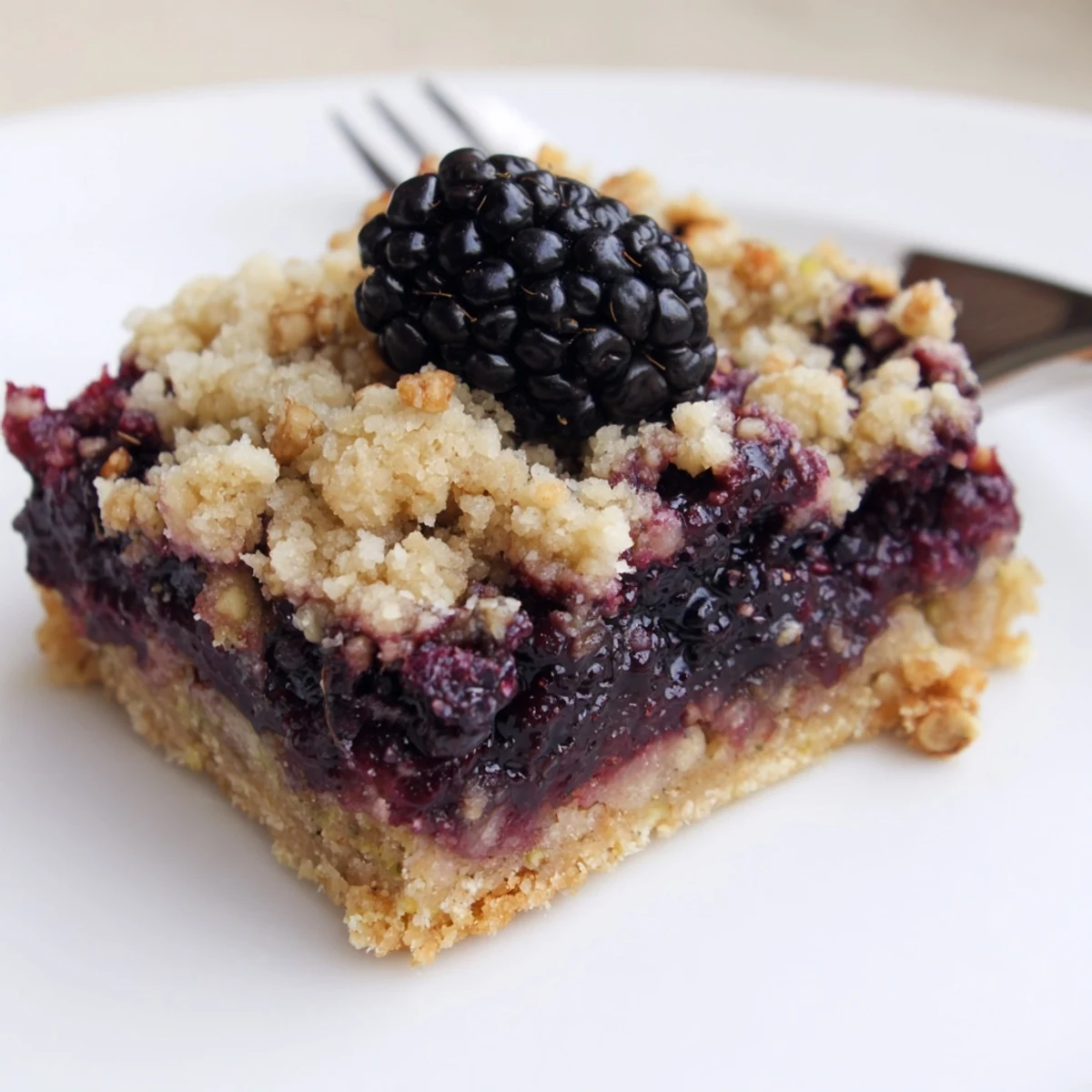 Blackberry Pistachio Bars with golden streusel and juicy berry filling