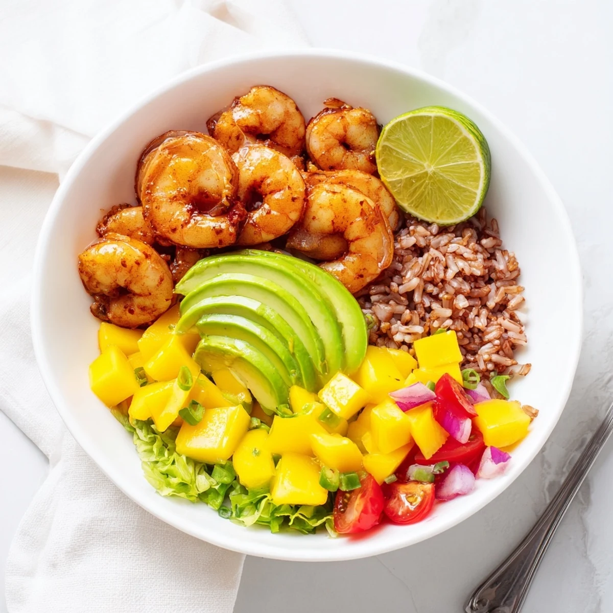 Shrimp And Avocado Bowls With Mango Salsa Lime Chili Sauce, served over warm quinoa