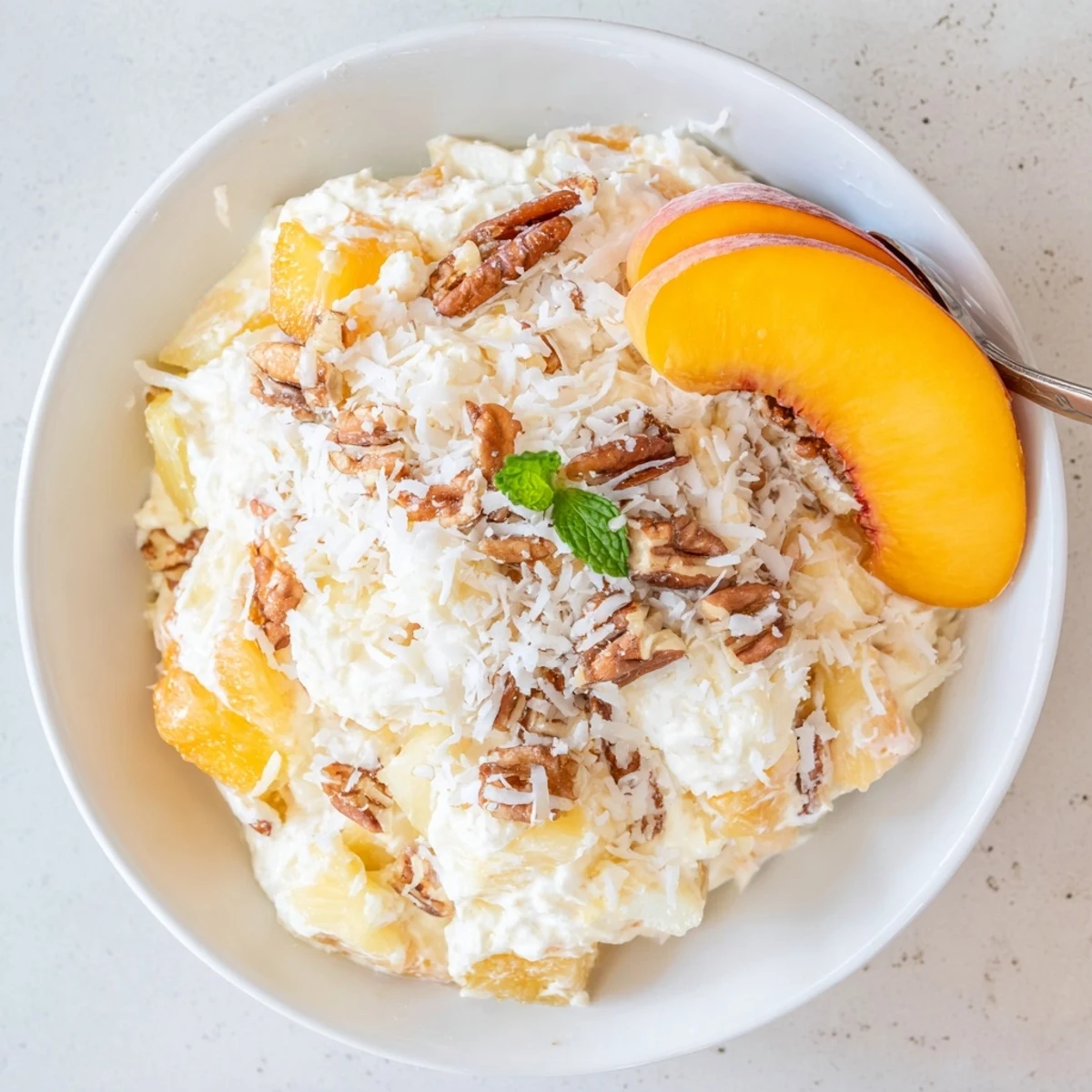 Summer-ready Millionaire Peach Salad: juicy peaches, mandarin sweetness, whipped cream layer