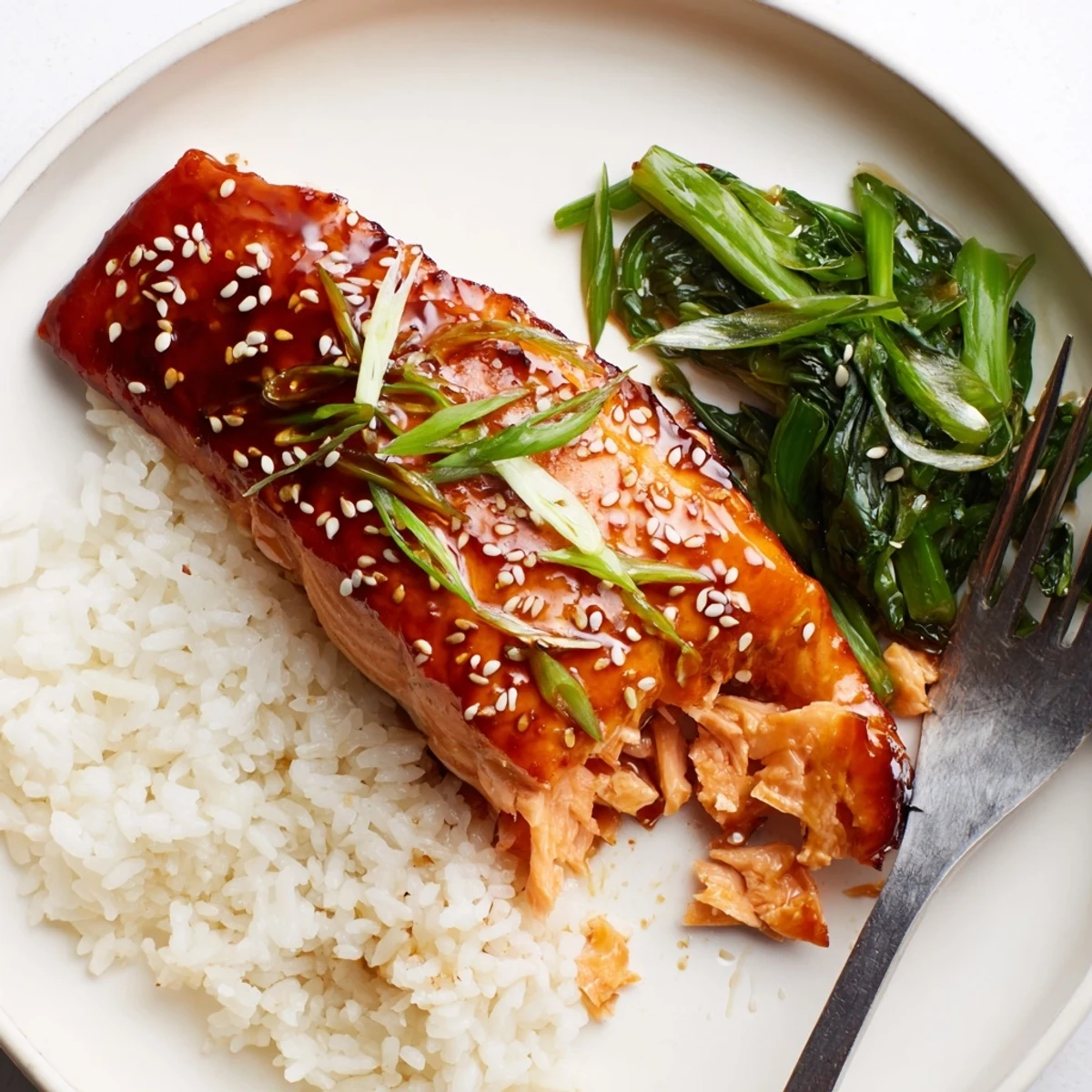 Weeknight Baked Teriyaki Salmon flaky, sweet-savory glaze, served with sauteed greens.