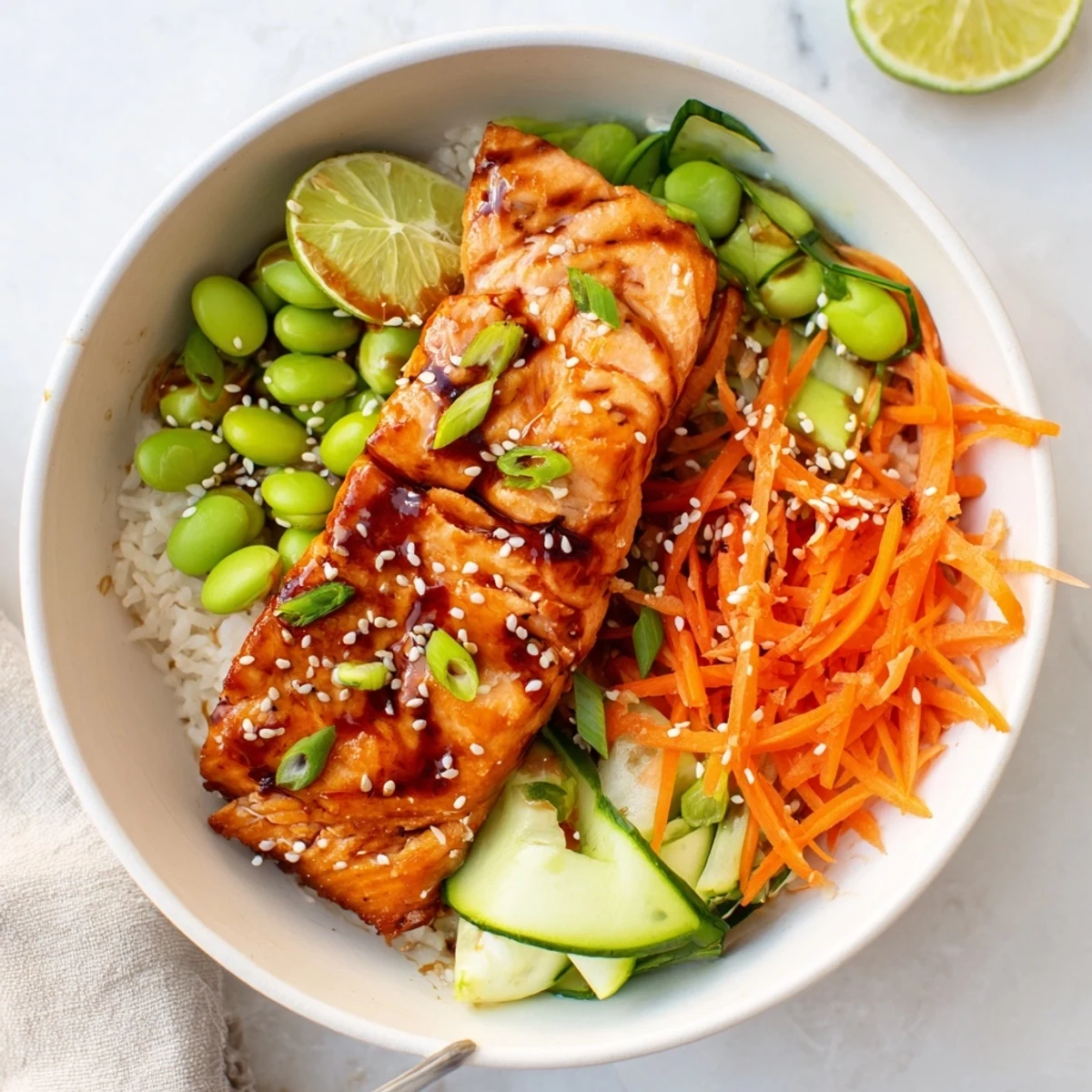 Bright Honey Glazed Salmon Bowl served with creamy avocado and tangy glaze.