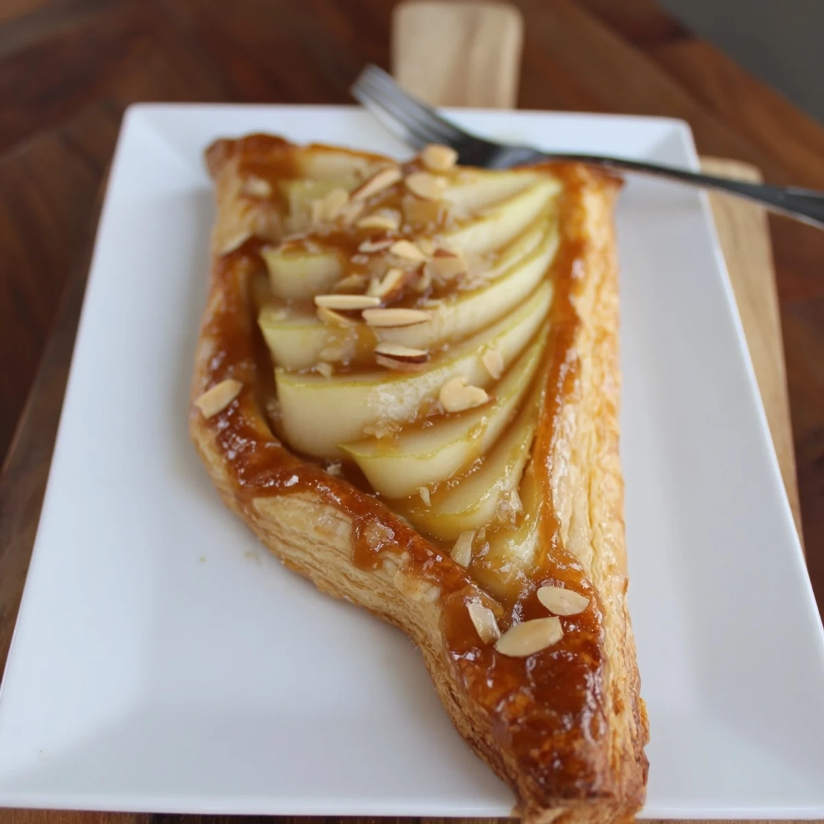 Homestyle Pear Puff Pastry Recipe showcasing flaky crust and tender glazed pear.