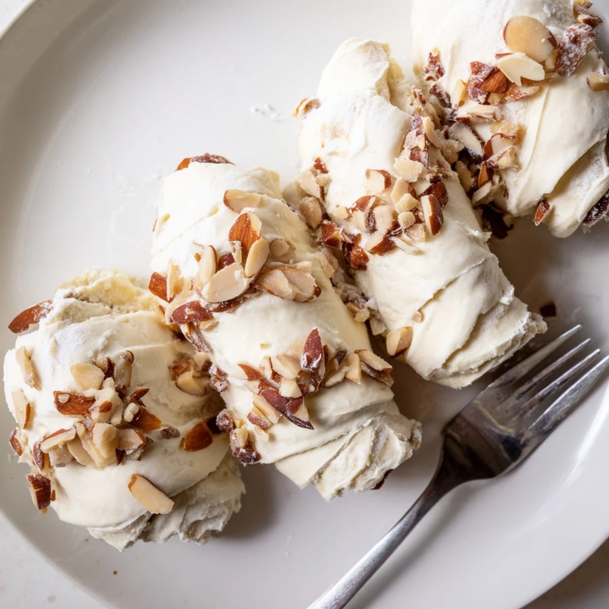 Sliced open to show creamy filling, Almond Cream Cheese Rolls smell buttery