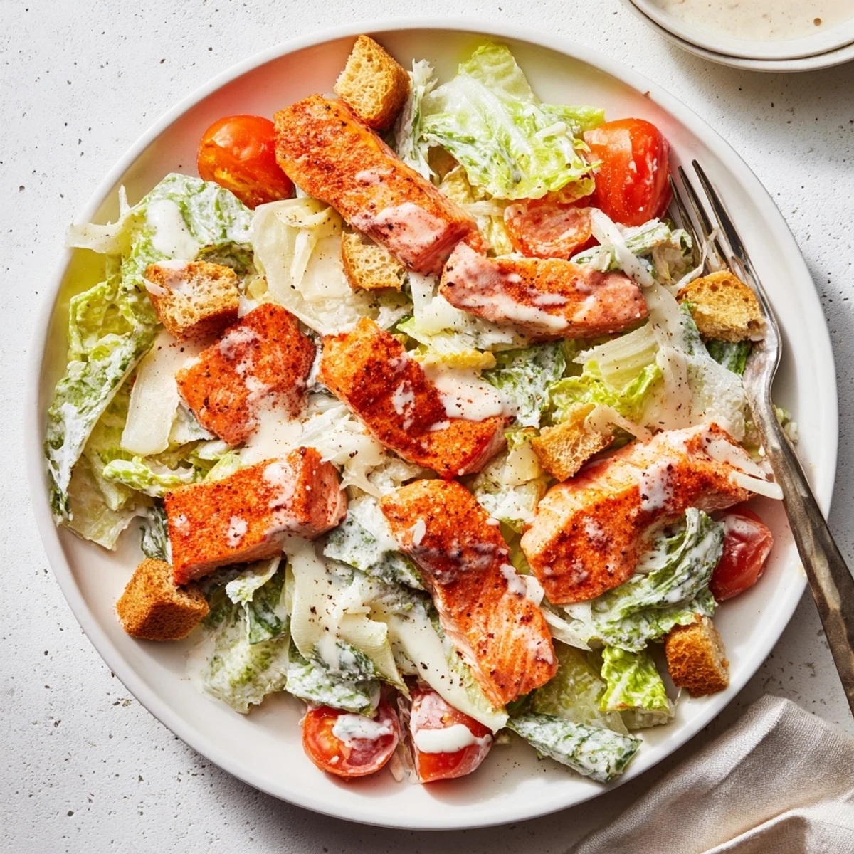 Savory weeknight salad served with chilled Pinot Grigio — Smoky Salmon Caesar Salad Recipe.