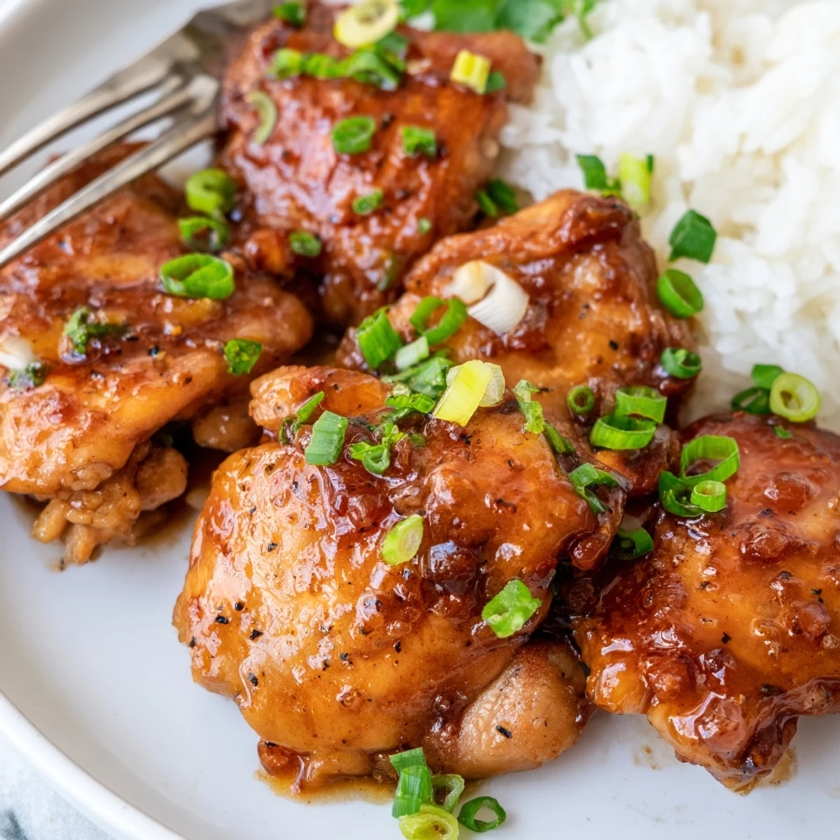 Juicy Sweet And Sticky Honey Butter Chicken Thighs, fragrant garlic notes and parsley garnish