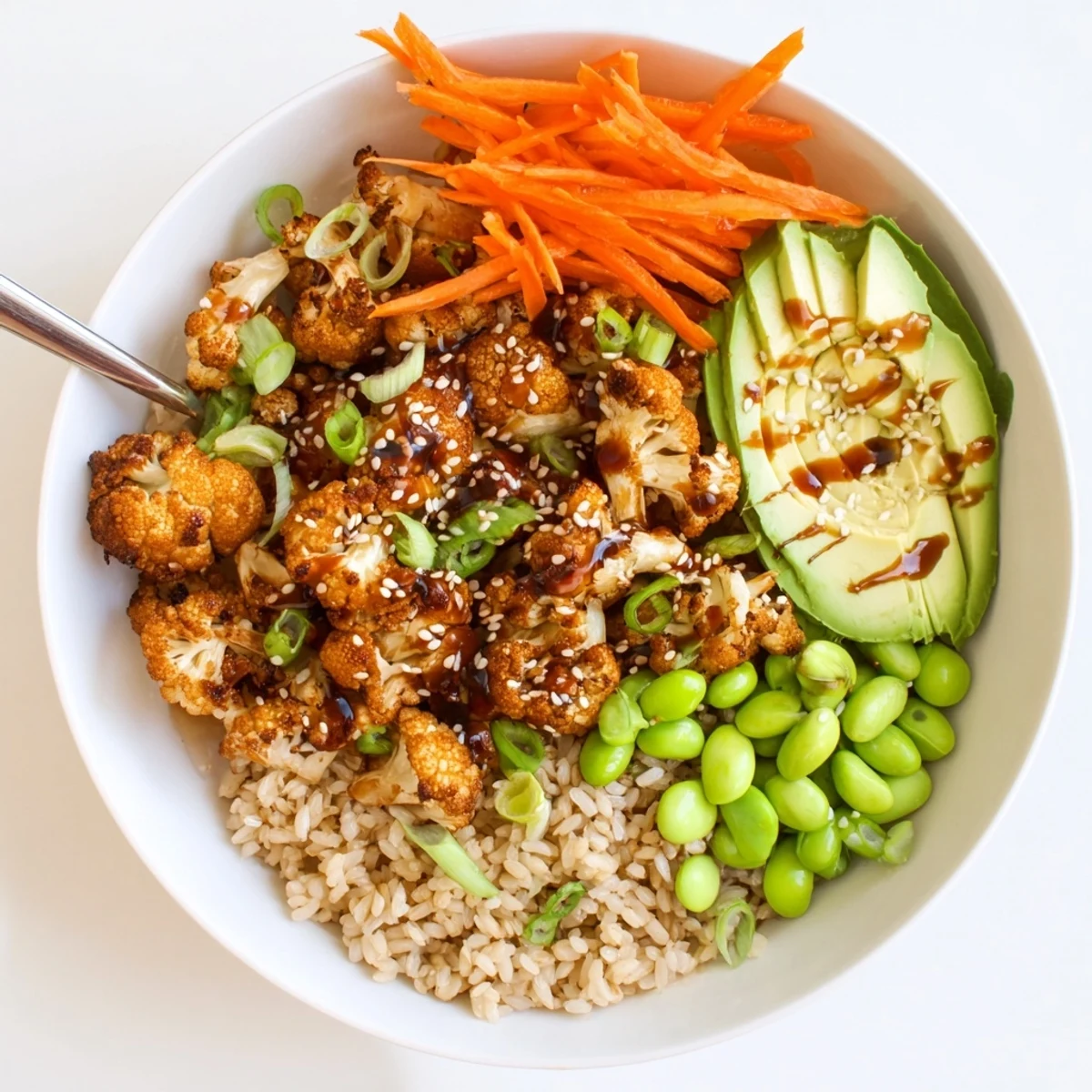 Family-style Teriyaki Cauliflower Power Bowls ready to serve, crisp vegetables visible.