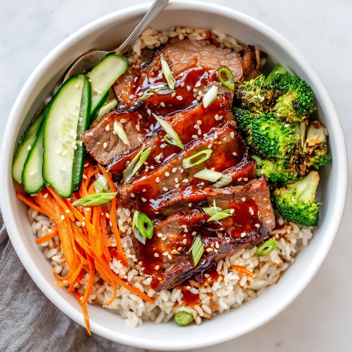 Aromatic Savory Char Siu Beef Rice Bowl garnished with scallions and sesame seeds