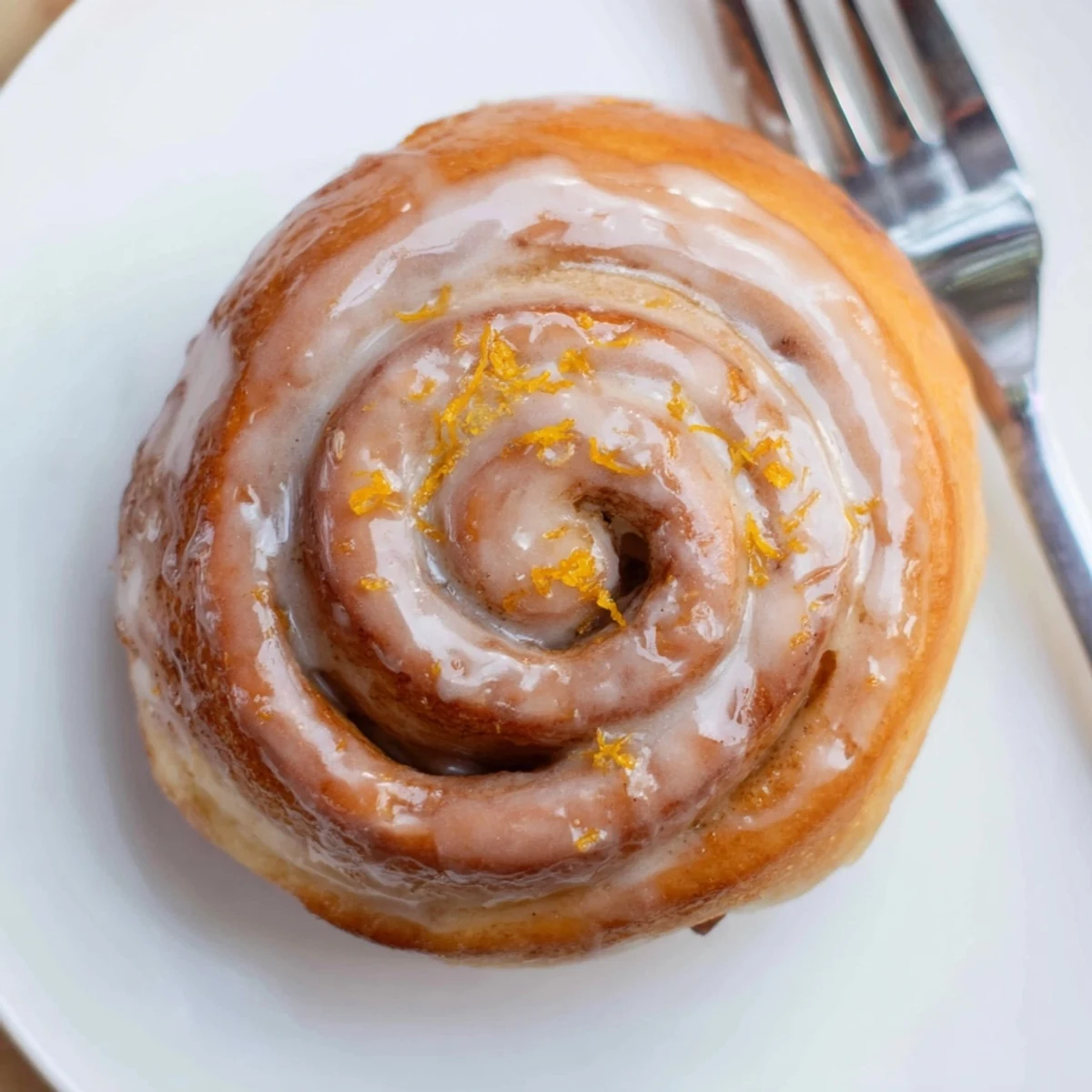 Tray of Orange Cardamom Morning Buns Recipe, tender spirals topped with citrus glaze