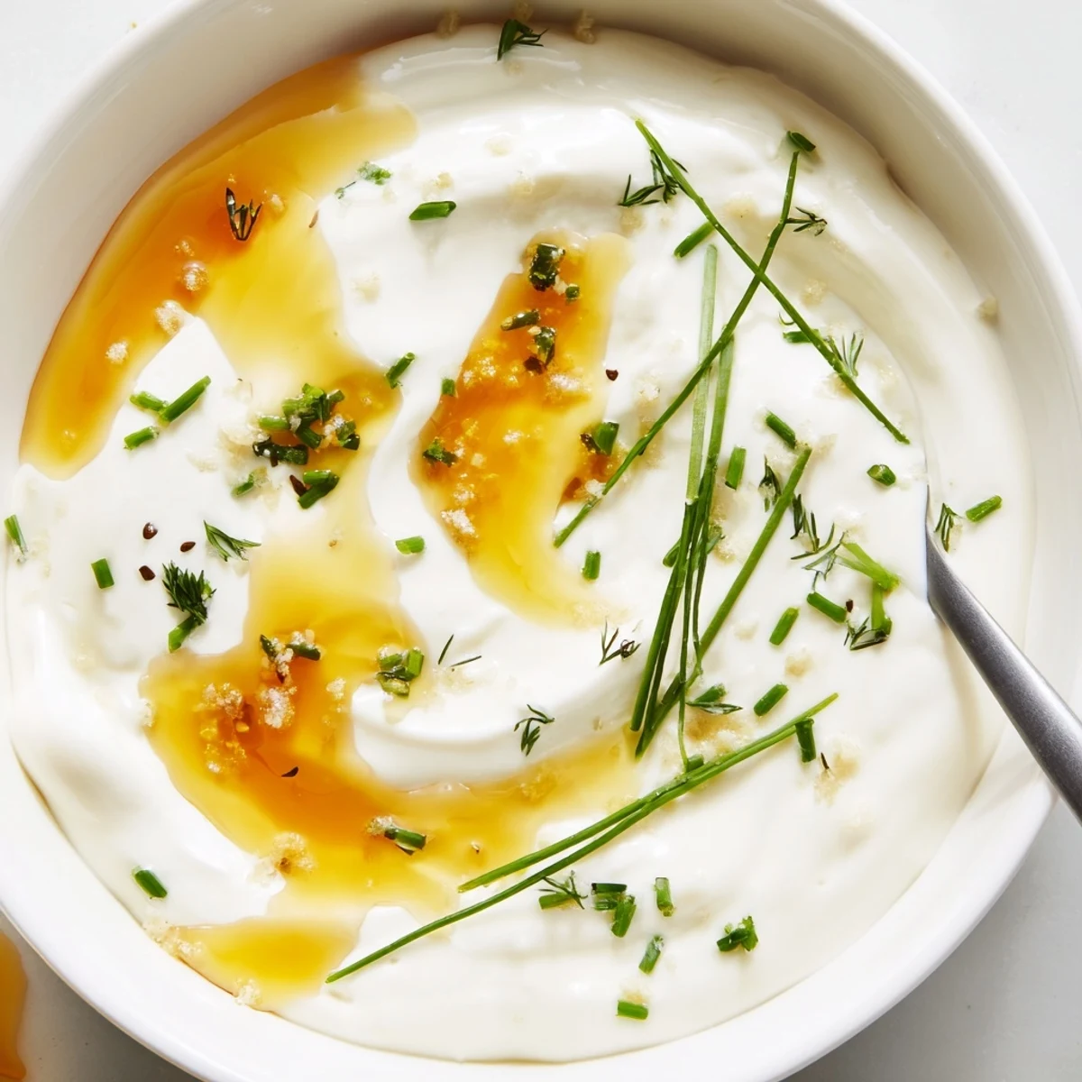 Hot Honey Ranch Dip glistening with honey drizzle, chilled, served with veggies