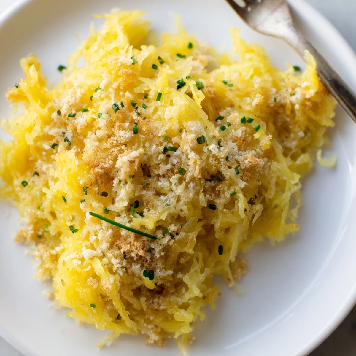 Golden baked spaghetti squash mac and cheese topped with crispy breadcrumbs and melted cheddar