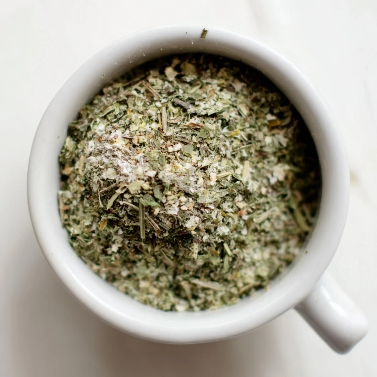 Spoonful of Dehydrated Tzatziki Seasoning Mix over yogurt, fragrant and zesty