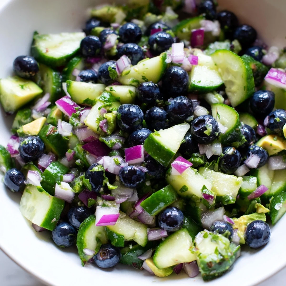 A bright bowl of blueberry cucumber salsa studded with plump berries and crisp green chunks