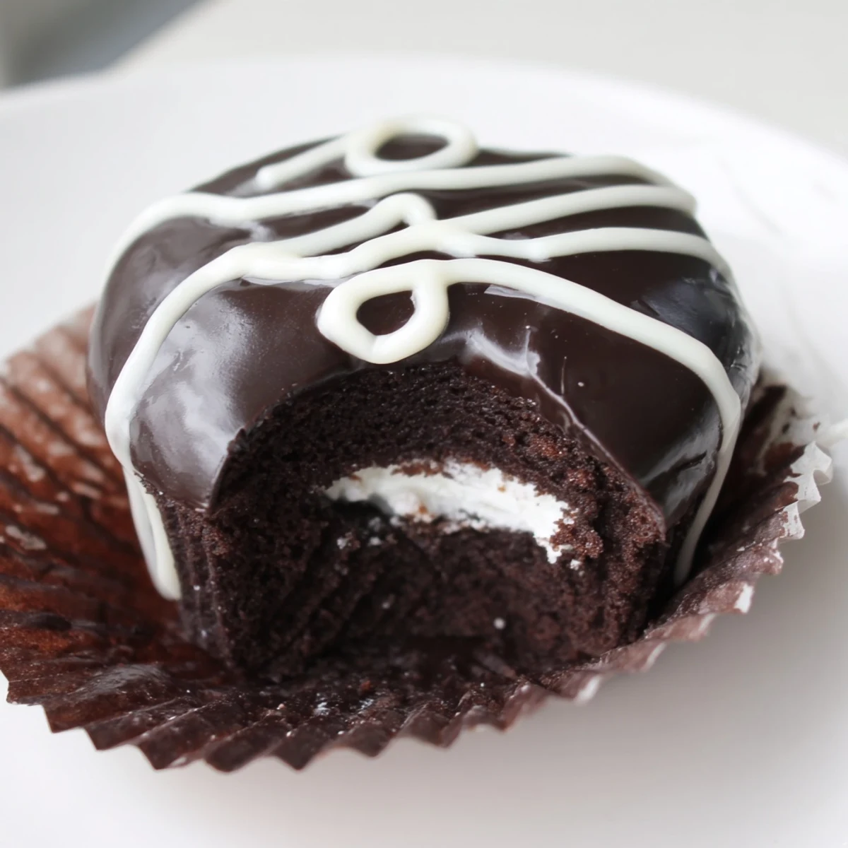 Fluffy marshmallow-filled Homemade Hostess Cupcakes drizzled in rich dark chocolate ganache
