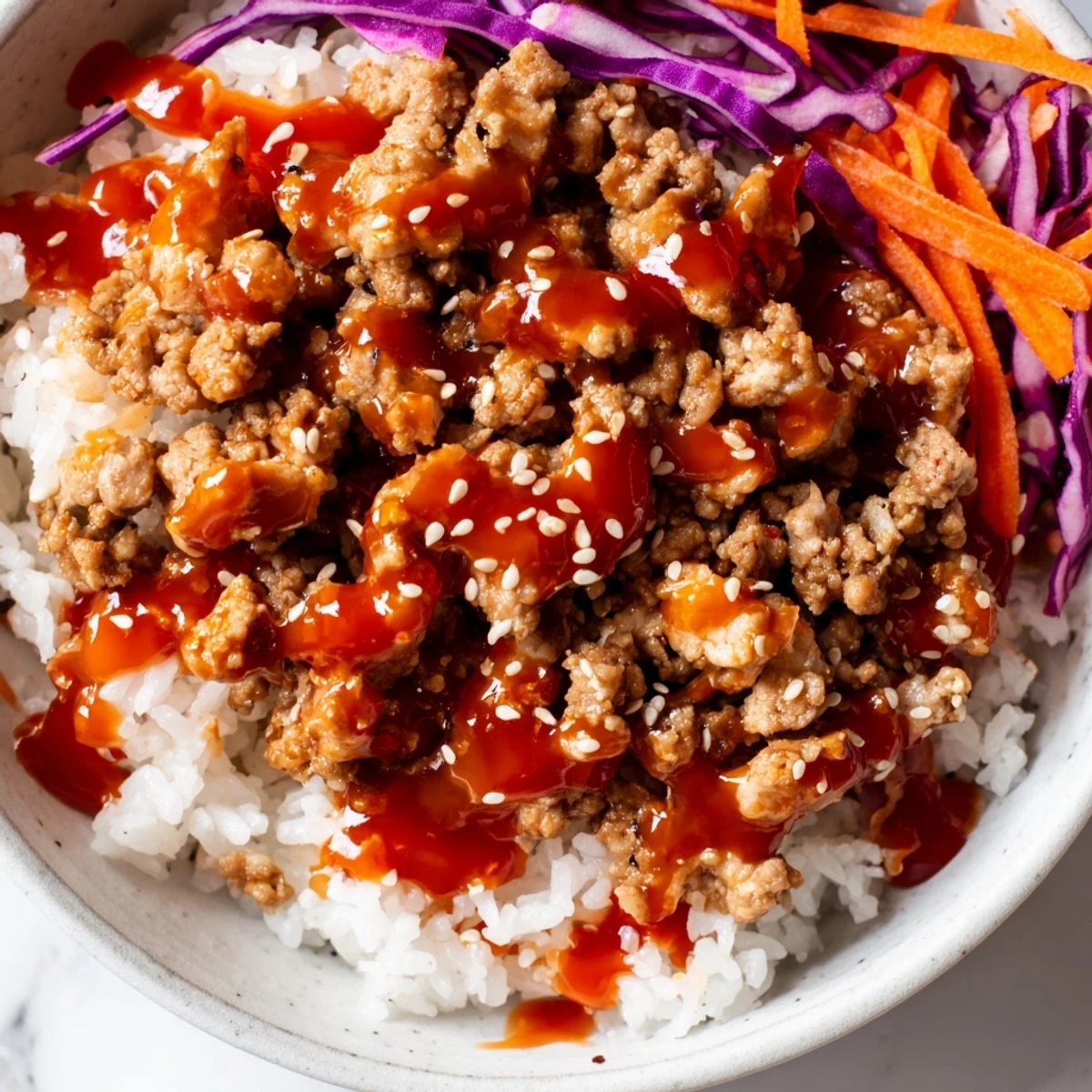 Seasoned ground turkey piled on fluffy jasmine rice with colorful crunchy vegetable toppings