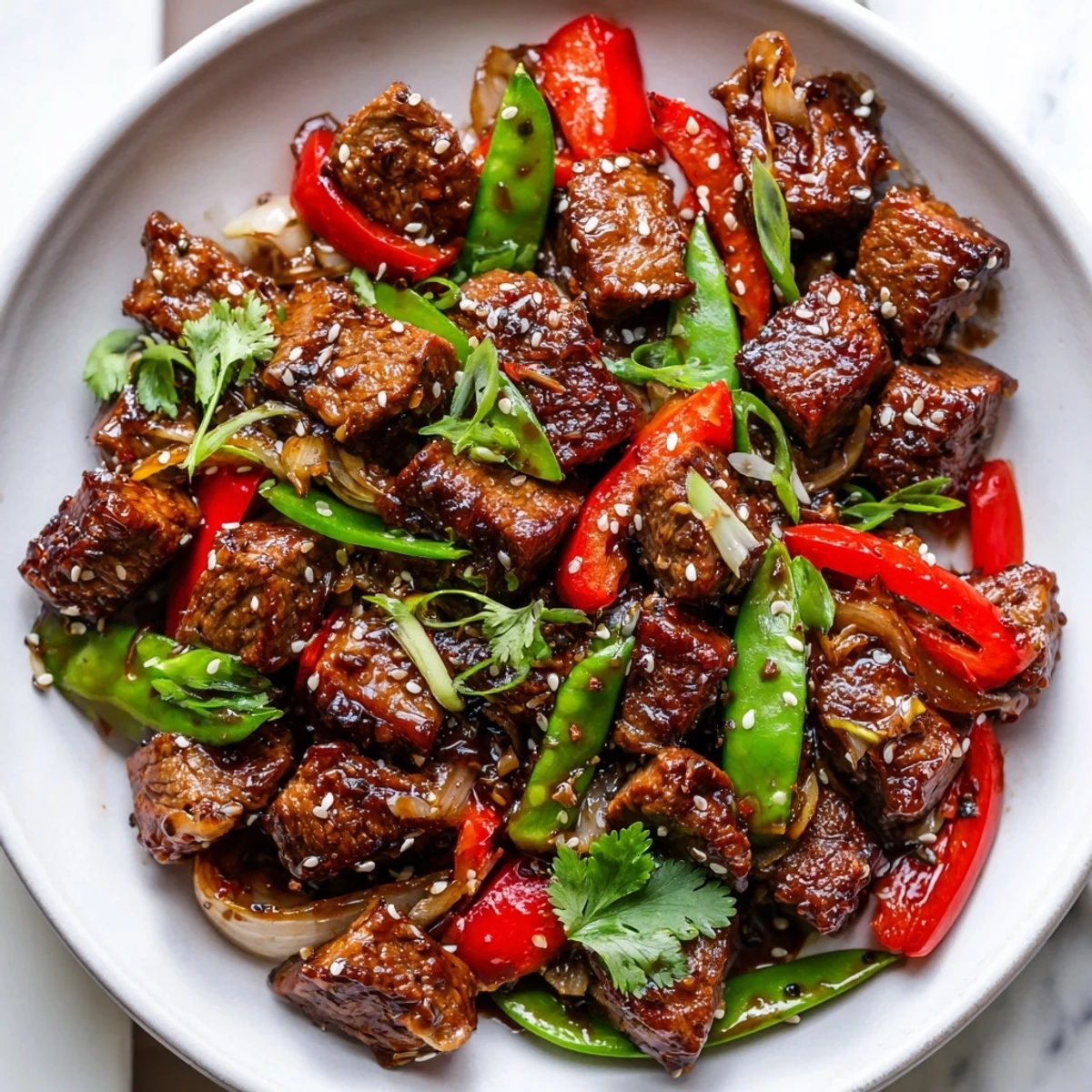 Asian inspired cube steak glazed with soy ginger sauce and colorful crisp vegetables