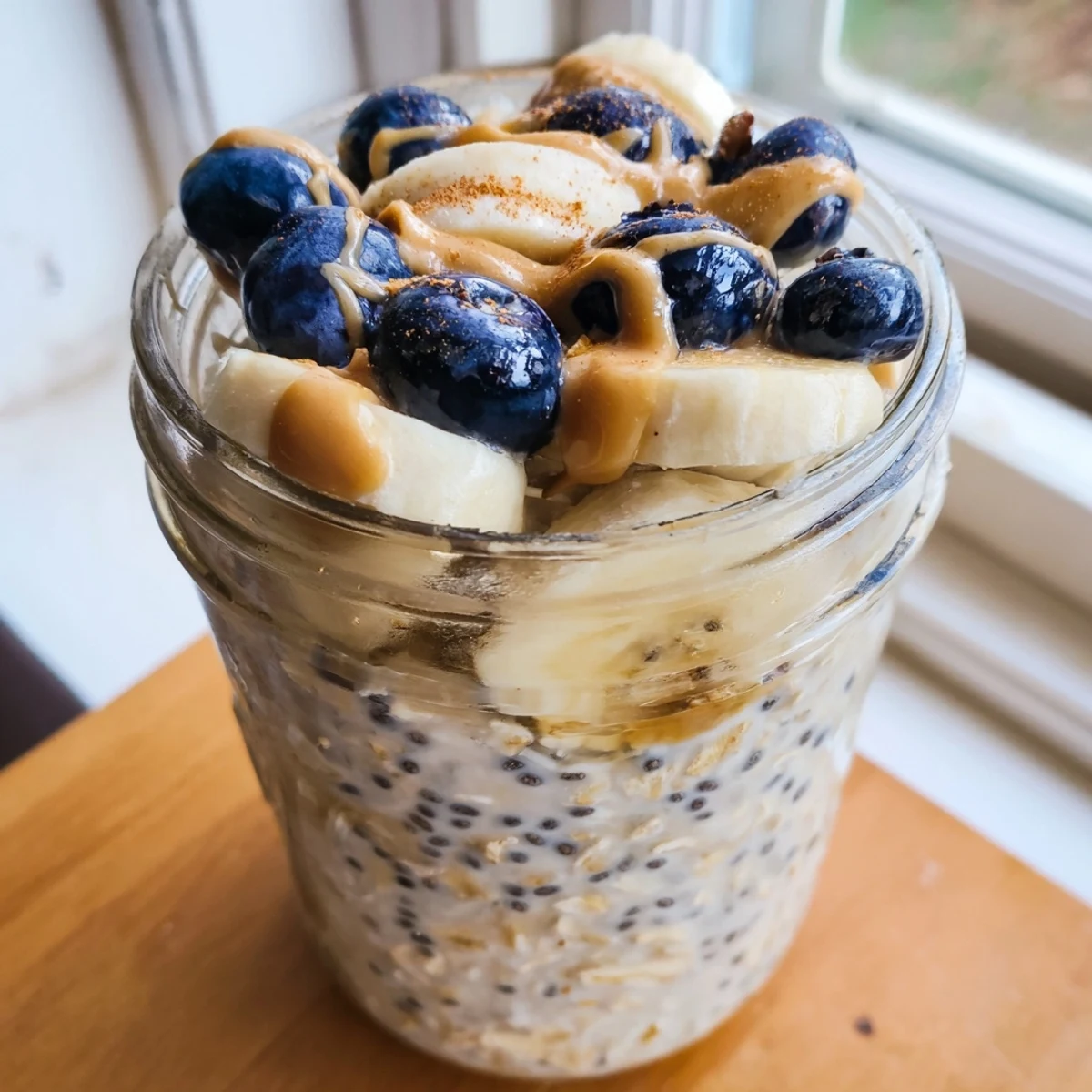 Protein overnight oats served cold with sliced banana and a cinnamon dusting