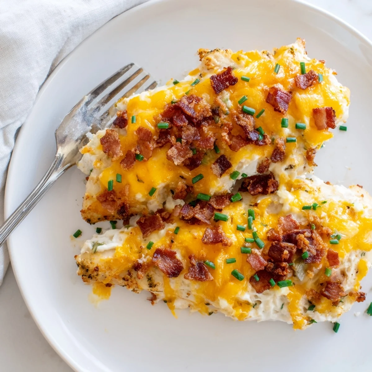 Golden baked crack chicken with bubbling cheddar and crispy bacon toppings