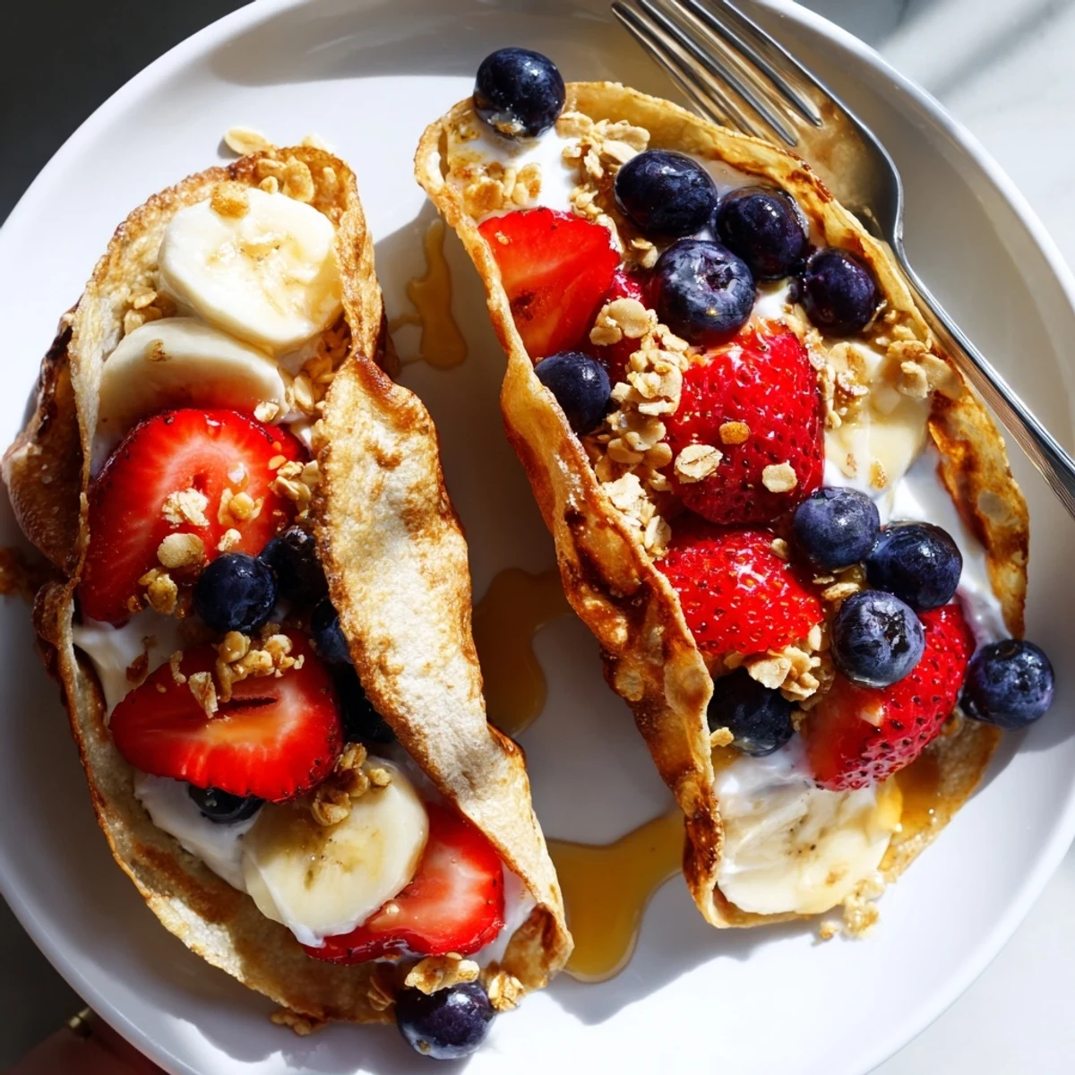 Soft pancake tacos topped with Greek yogurt blueberries and crunchy granola