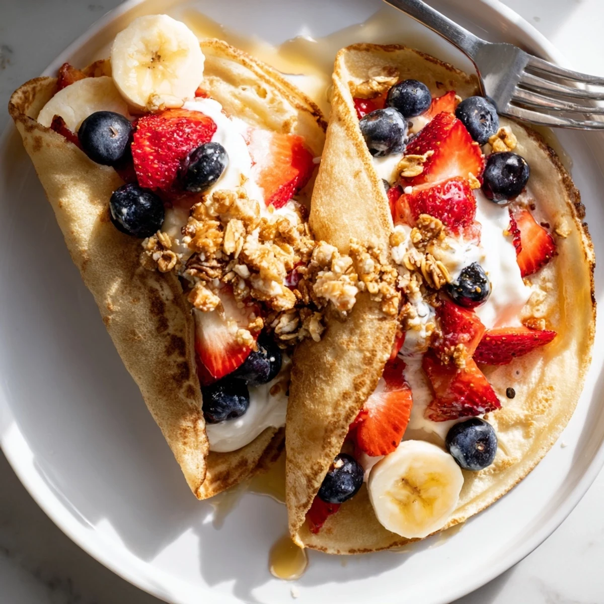 Golden pancake tacos folded around scrambled eggs and crumbled bacon bits