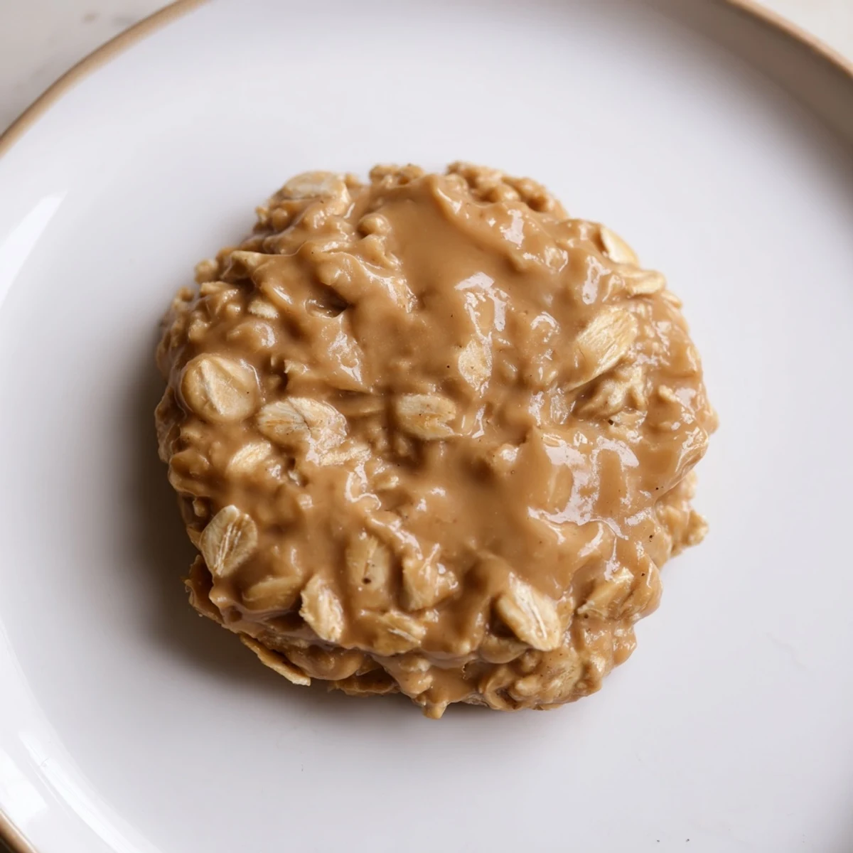 Golden peanut butter no bake cookies topped with creamy oats and chocolate chips.