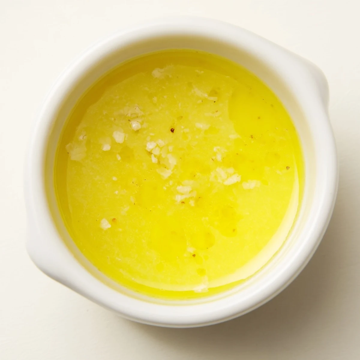 Creamy Lemon Vinaigrette Dressing Recipe coating a crisp salad with visible lemon zest.