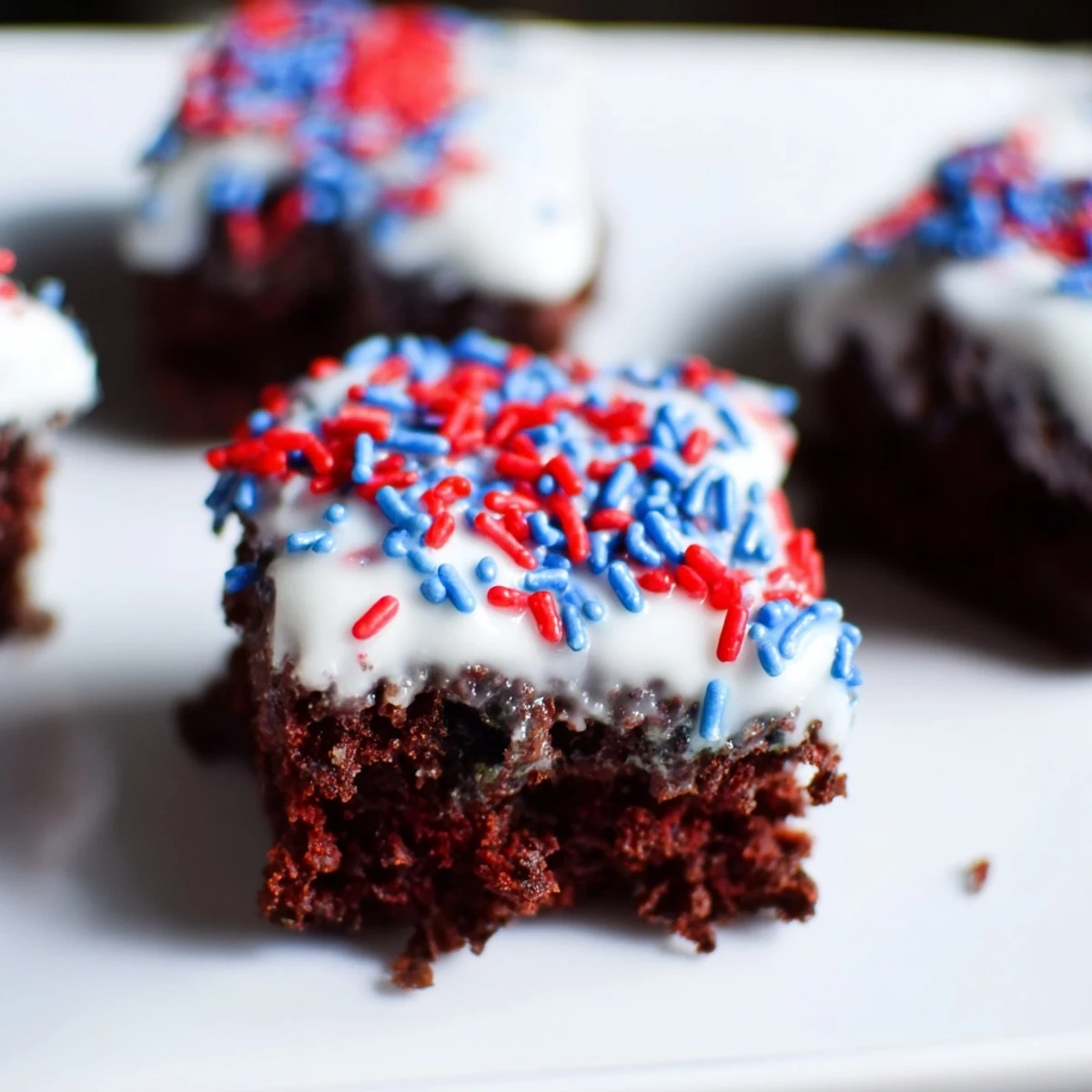 Fourth of July brownie bites topped with red and blue sprinkles.  